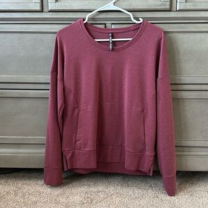 Women’s size small raspberry Kuhl long sleeve shirt with middle pocket.